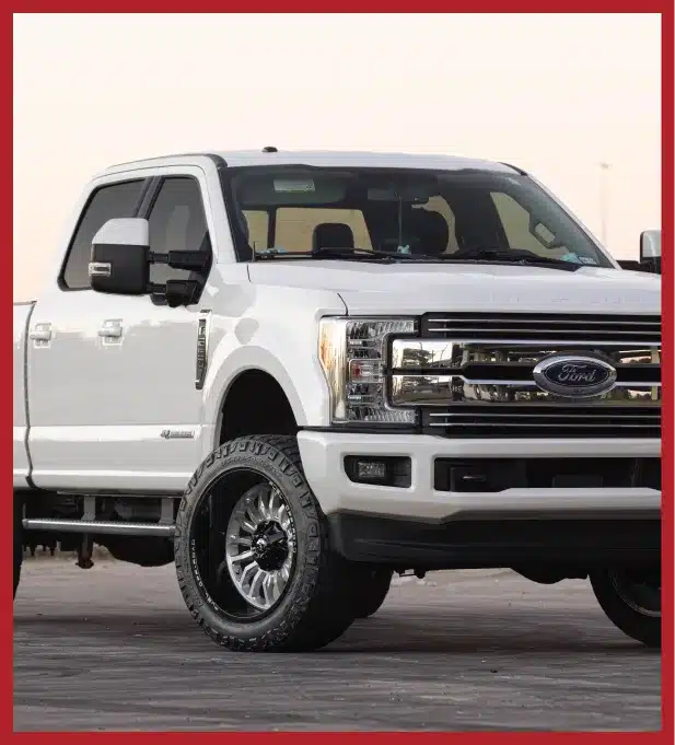 a white truck parked on a concrete surface
