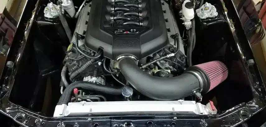 a car engine with a black cover