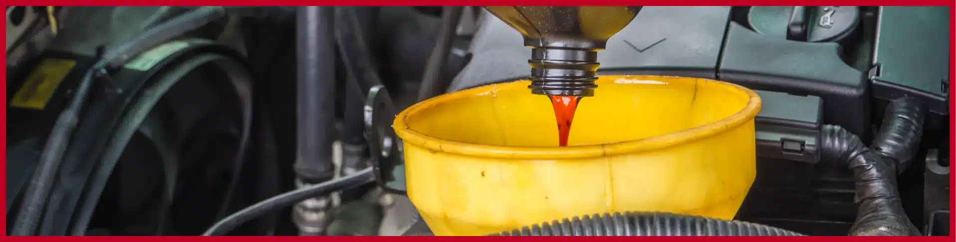 echnician changing engine oil at E-Motive Performance Mertztown PA using premium motor oil