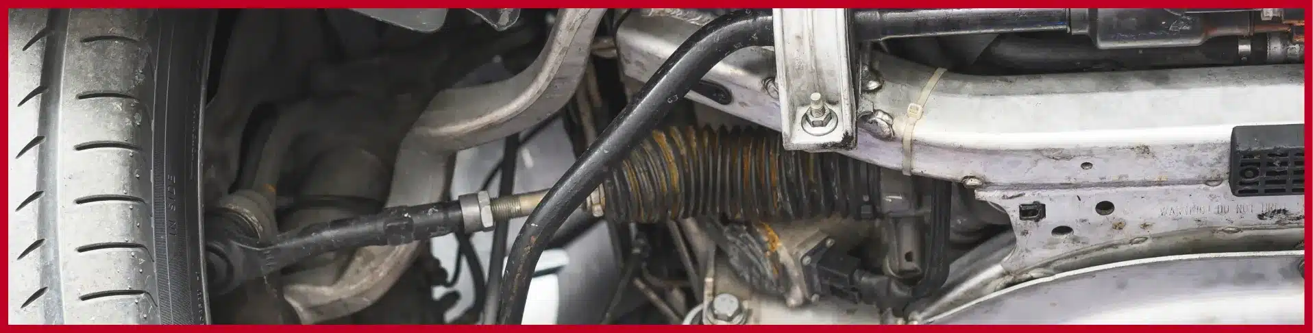 Technician repairing vehicle suspension system at E-Motive Performance Mertztown PA