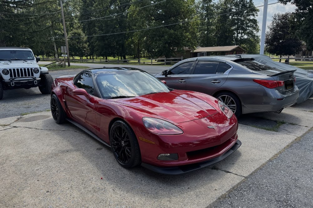 a red sports car parked in a parking lot