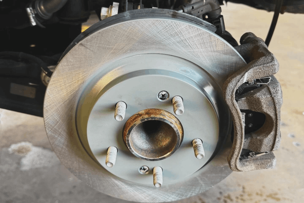 Winter brake repair in Mertztown, PA by E-Motive Performance & Auto Repair. Image of a brake rotor and caliper, highlighting precise braking performance, enhanced safety, and dependable stopping power through quality brake service.