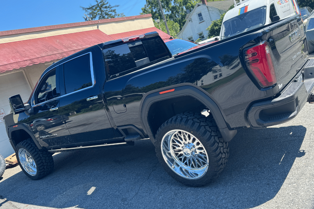 Spring Car Care Service in Mertztown PA At E-Motive Performance & Auto Repair. Pickup truck parked outside viewed from the rear for car care service